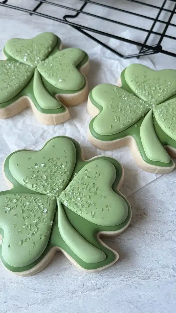 Custom St. Patrick’s Day cookies designed by Cami Logan, featuring intricate decorations.