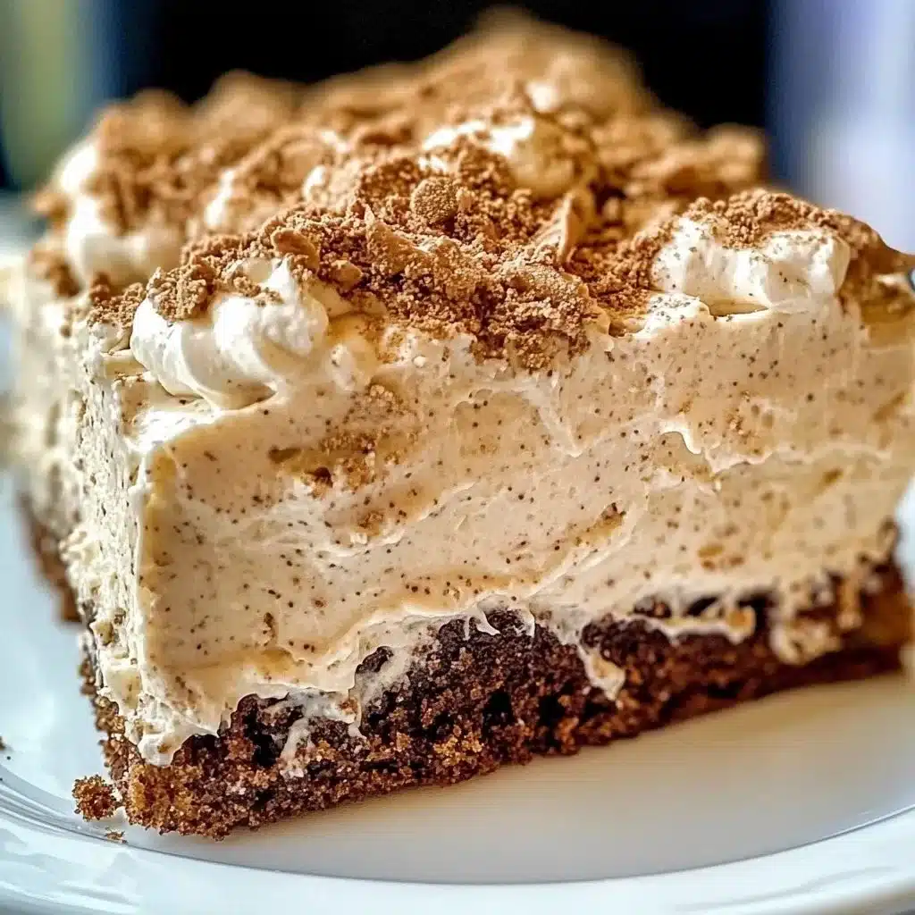 Delicious Irish Cream Poke Cake served with whipped cream and chocolate shavings.
