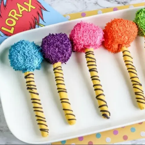 Colorful Truffula Tree Pretzel Rods decorated for a whimsical treat inspired by Dr. Seuss.