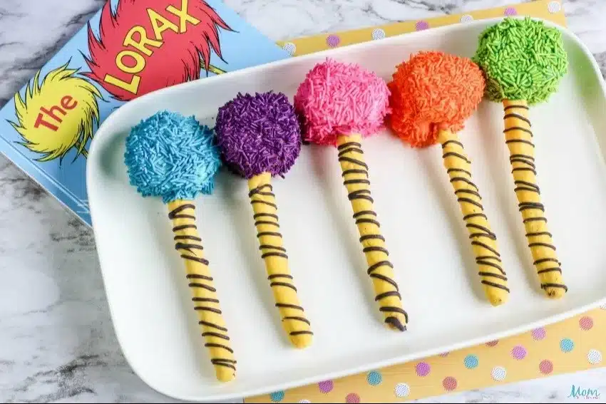 Colorful Truffula Tree Pretzel Rods decorated for a whimsical treat inspired by Dr. Seuss.