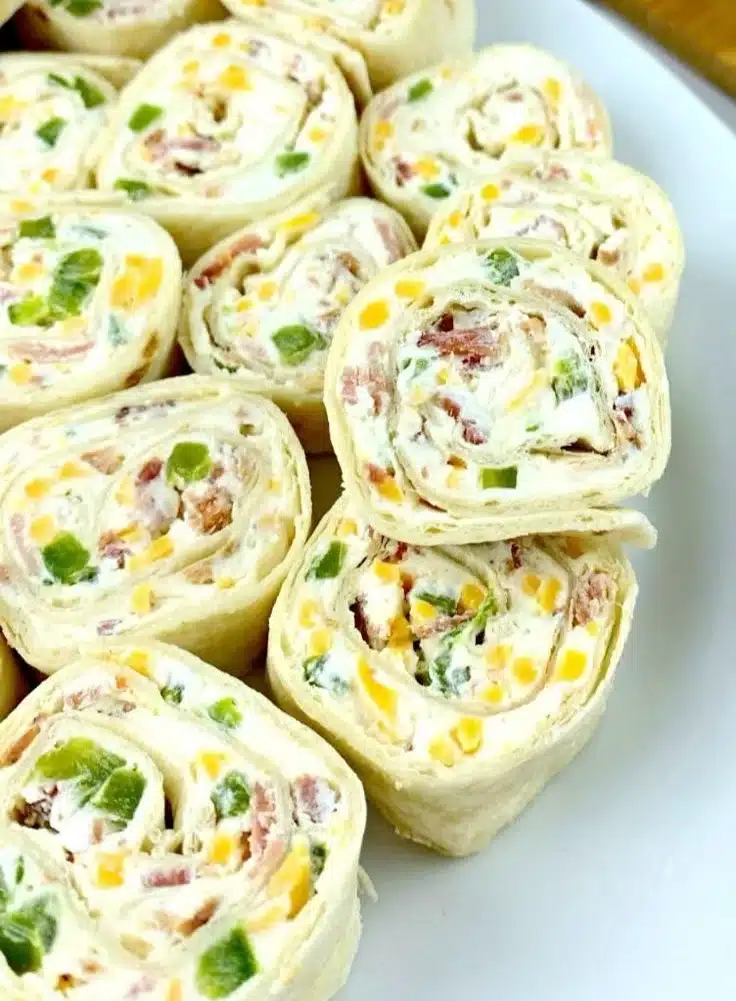 Jalapeño Popper Pinwheels ready to serve with cream cheese and jalapeños
