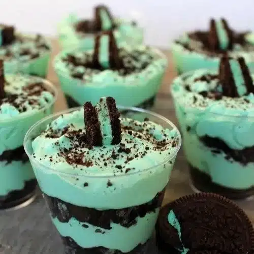 Layered Mint Oreo Parfaits with mint cream and crushed Oreos