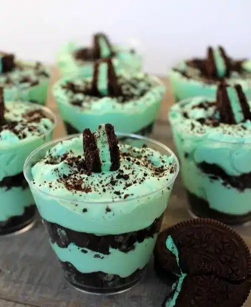 Layered Mint Oreo Parfaits with mint cream and crushed Oreos