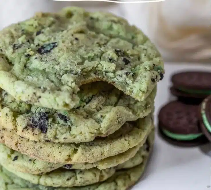 Oreo Shamrock Shake Cookies topped with mint cream and crushed Oreos.