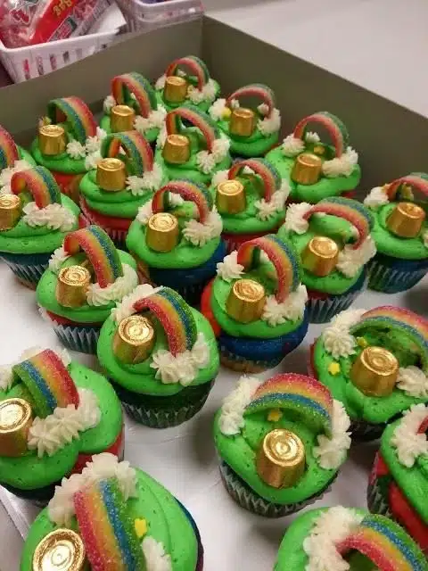 Deliciously colorful Rainbow Cupcakes decorated with bright frosting.