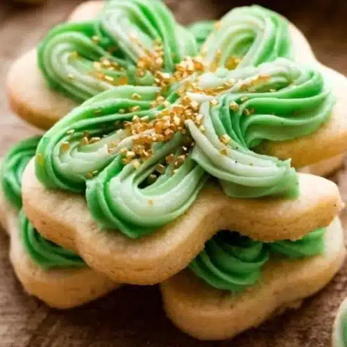 A plate of green Shamrock Cookies decorated for St. Patrick's Day.