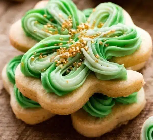 A plate of green Shamrock Cookies decorated for St. Patrick's Day.