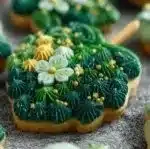 Freshly baked Shamrock Cookies with green icing and sprinkles.