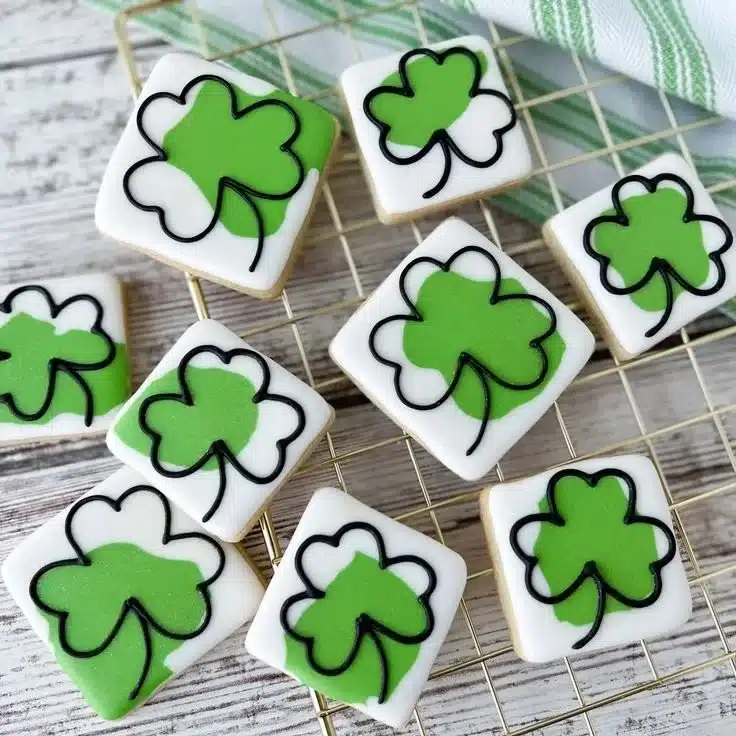 Colorful St. Patrick's Day cookies decorated with shamrocks and rainbows