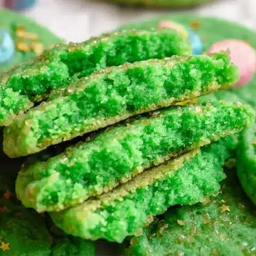 Festively decorated St. Patrick's Day cookies featuring green icing and shamrock shapes.