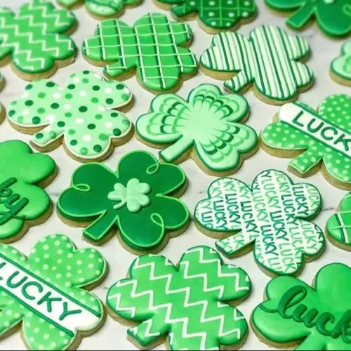 Decorated St. Patrick's Day sugar cookies in festive shapes.