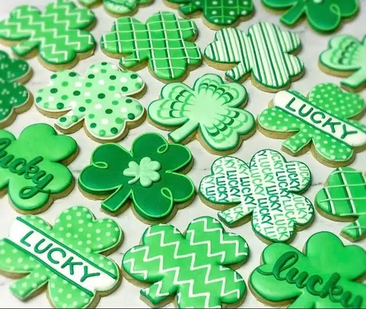 Decorated St. Patrick's Day sugar cookies in festive shapes.