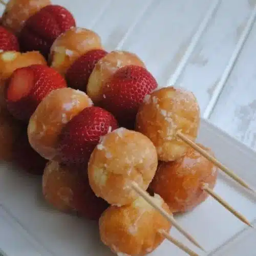 Delicious Strawberry Donut Kabobs with fresh strawberries and mini donuts on skewers