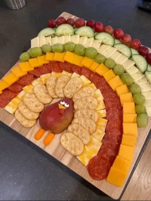 Beautiful Thanksgiving charcuterie turkey featuring gourmet cheeses and seasonal treats.