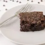 Delicious homemade zucchini brownies on a plate, rich and fudgy dessert.