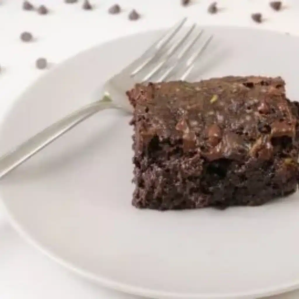 Delicious homemade zucchini brownies on a plate, rich and fudgy dessert.